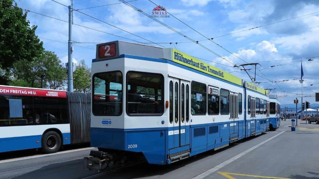 Modern Zurich tram passing through city streets with efficient public transport system.