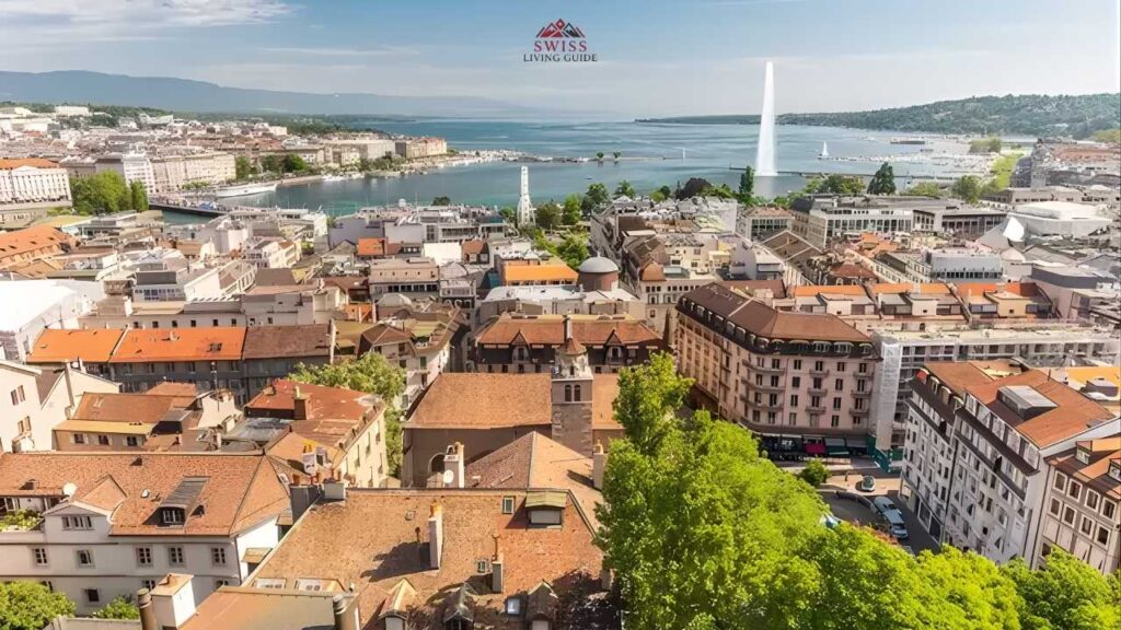 St. Peter’s Cathedral tower overlooking Geneva rooftops with Lake Geneva and Alps in the background